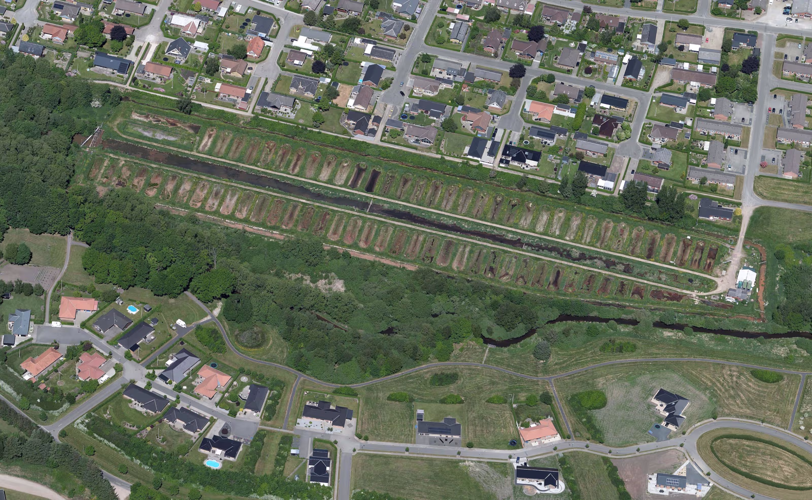 Skråfoto af det nedlagte Ansager Dambrug, som bliver til Ansager Søpark
