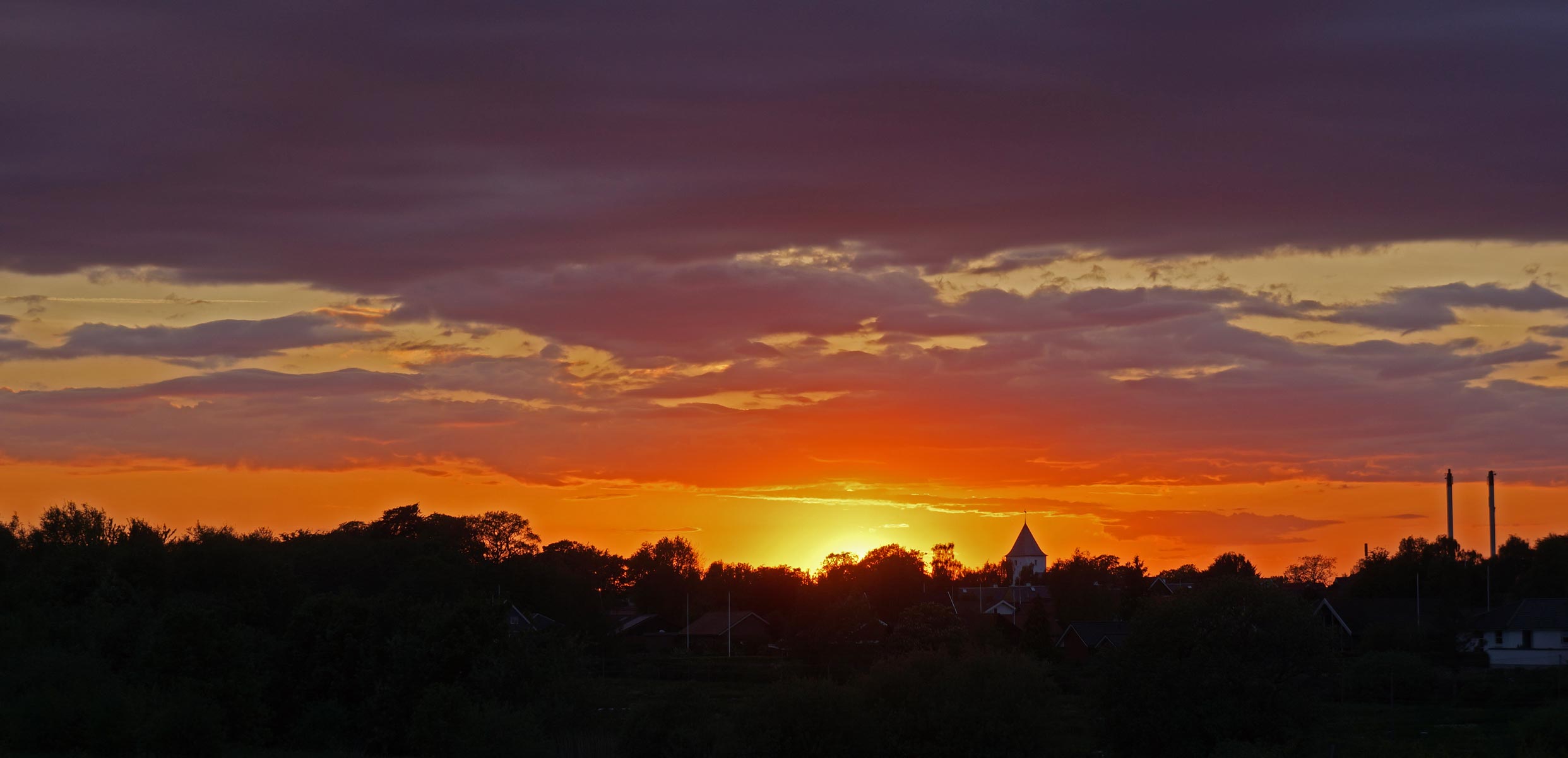 Solnedgang ved Ansager Kirke